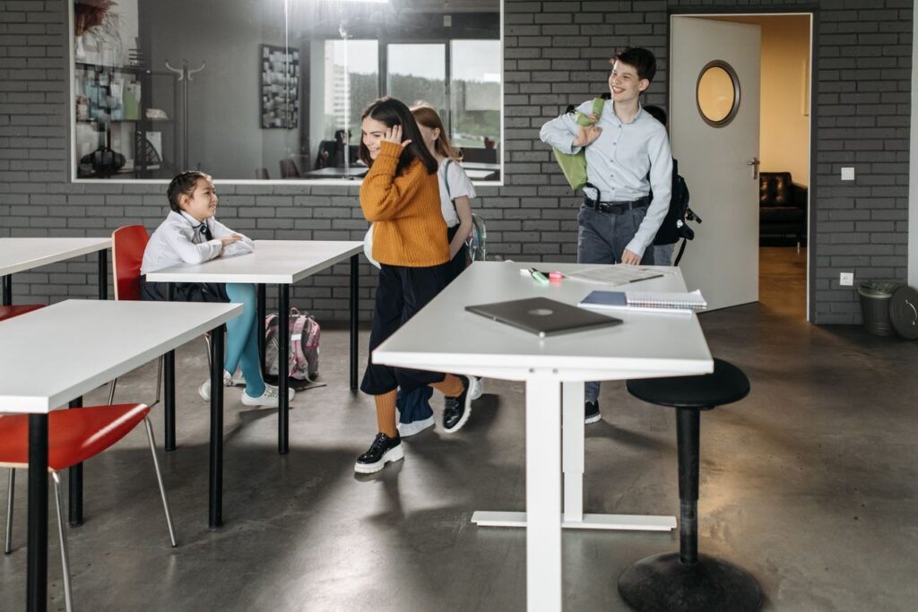 Students engage in a lively classroom environment, fostering a diverse and inclusive atmosphere.